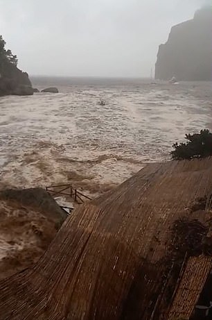 Staff were seen scrambling to save tables and chairs