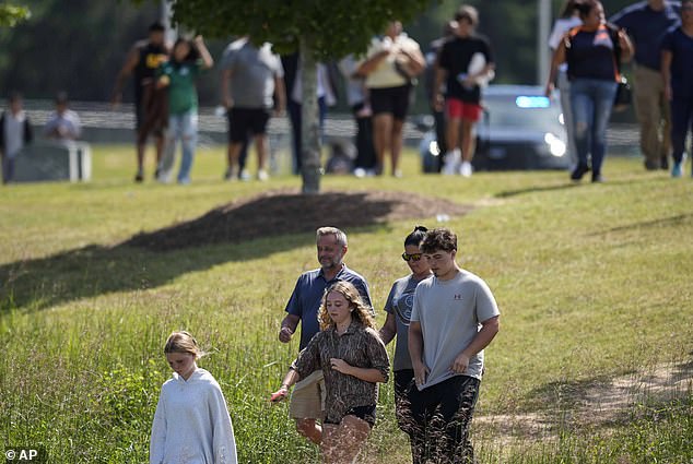 Students and parents leave the campus of Apalachee High School, Wednesday, September 4, 2024, in Winder