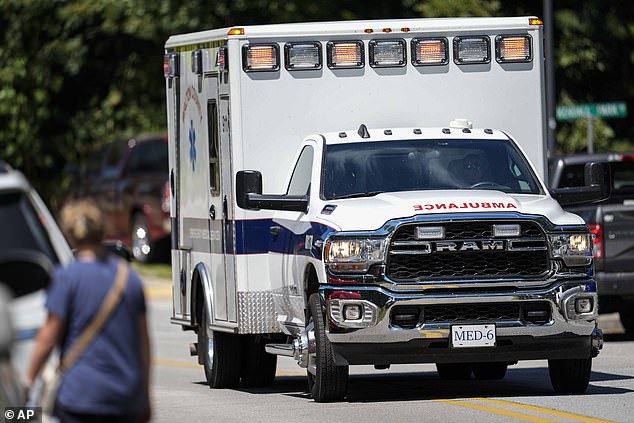 An ambulance leaves Apalachee High School after a shooting at the school