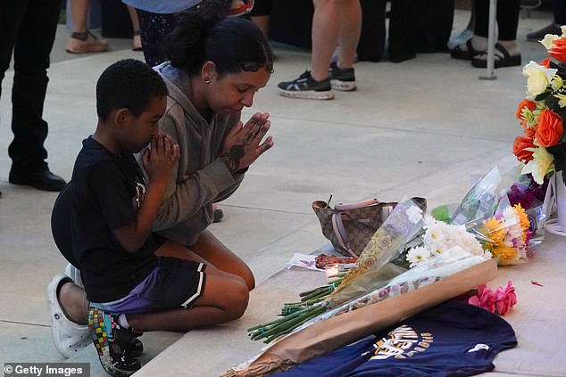 Students, teachers and community members gather for vigil following shooting at Apalachee High School