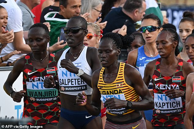 Cheptegei (pictured in a Ugandan running vest) died of complete organ failure after she was allegedly doused with petrol and set alight by her ex-boyfriend during an argument on Sunday