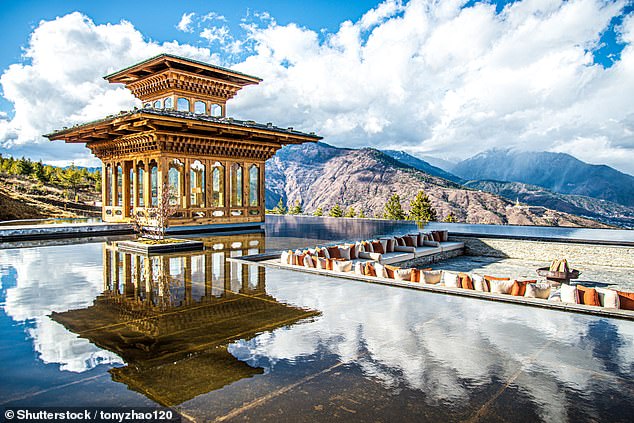 Sara stays at several Six Senses lodges during her visit. Above - the poolside chairs offer serene views of the mountains surrounding the Six Senses lodge in Thimphu, the capital