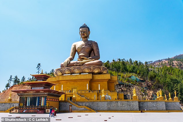 Glory: Above is the Dordenma Buddha statue in Thimphu, which is 169ft high. On the slopes outside Thimphu, Sara has a one-on-one guided meditation with a Buddhist master