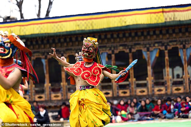 Culture: Sara says she loves 'everything about' Bhutan. Above, a masked dancer performs