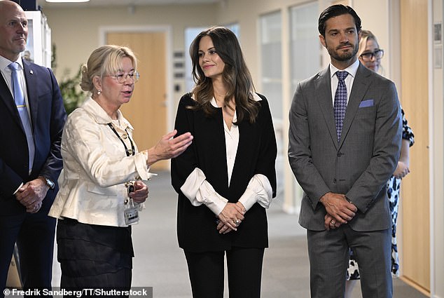 Prince Carl Phillip looked the picture of good taste in a smart gray suit and pale blue handkerchief, his beard neatly trimmed and his hair slicked back