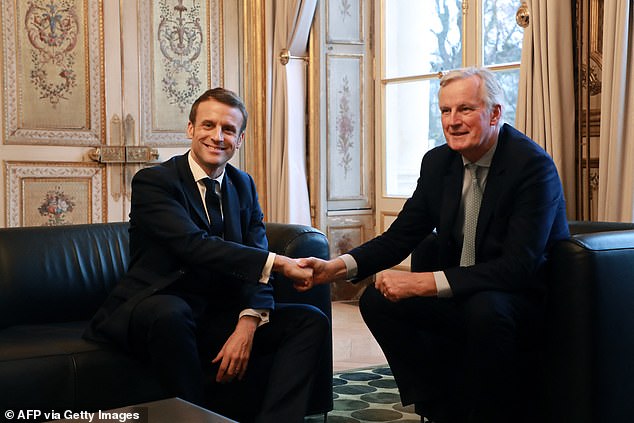 Barnier pictured with Emmanuel Macron at the Elysee Palace in Paris, on January 31, 2020, a few hours before Britain officially left the European Union