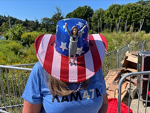 A supporter of Kamala Harris wears a hat with the vice president on it during her event in North Hampton, NH on September 4