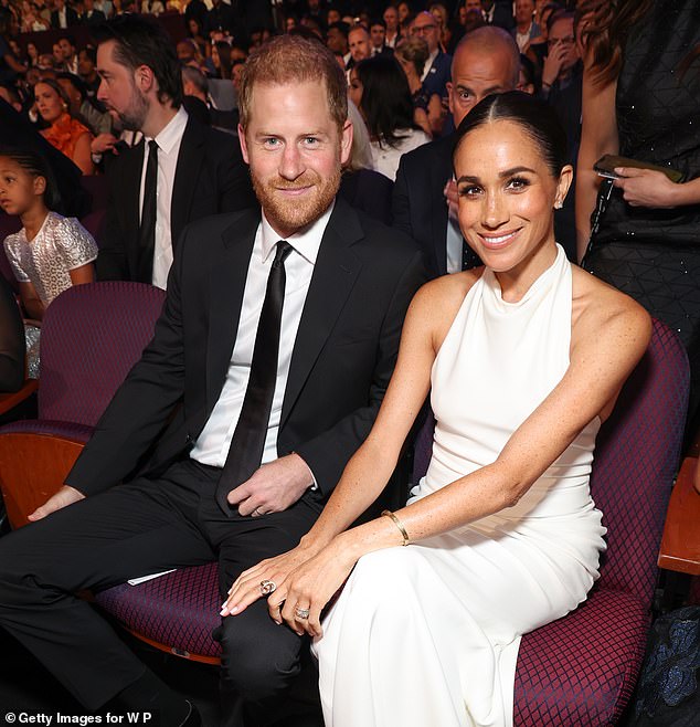 Meghan Markle beamed with pride as Prince Harry accepted a prestigious military award at the ESPY Awards at the Dolby Theatre in Los Angeles in July this year