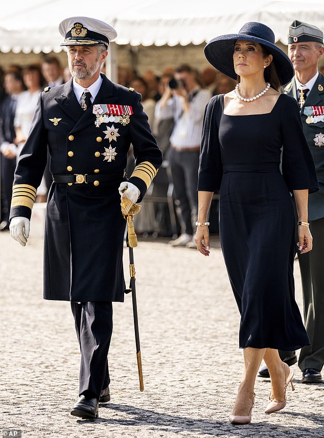 King Frederik, 56, dressed in military regalia, also appeared moved as he laid a wreath. The service was also attended by veterans