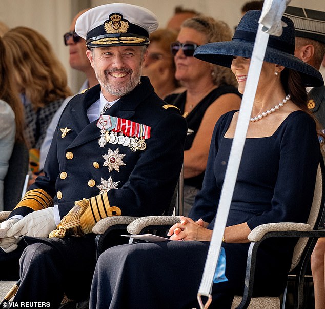 The Monarch managed to put a smile on his wife's face as he sat next to her during the ceremonies