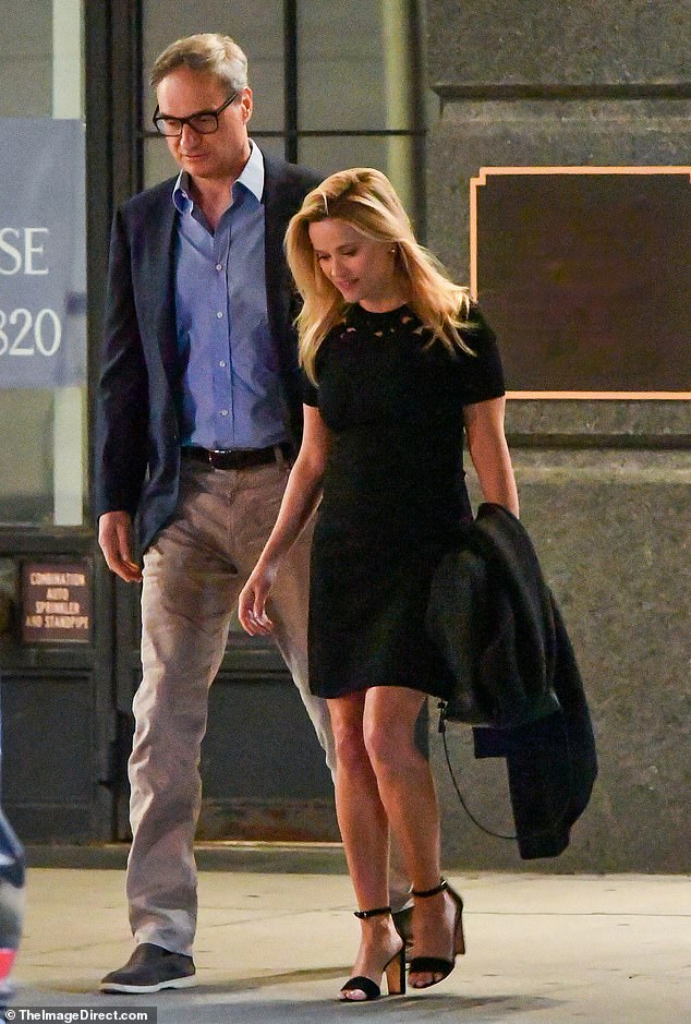 The couple chat as they walk to a waiting car