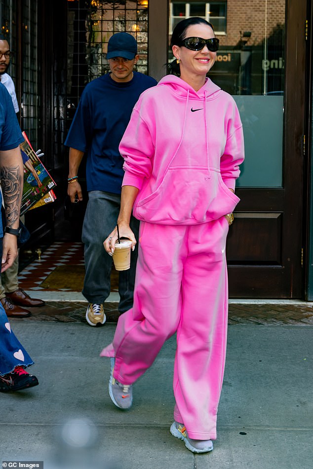 The 39-year-old Fireworks singer wore a pink Nike hoodie and sweatpants, wearing her raven black hair in a sleek ponytail.