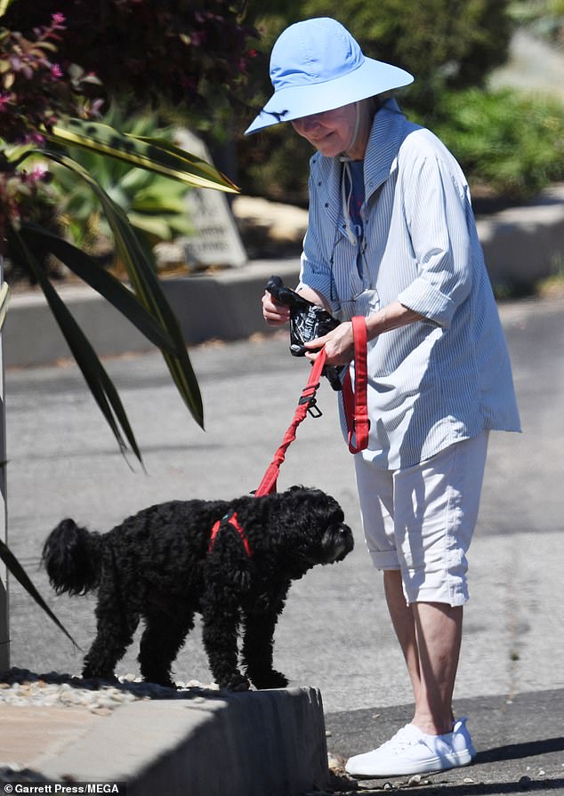 Her dog was fluffy and seemed obedient to the Hollywood legend