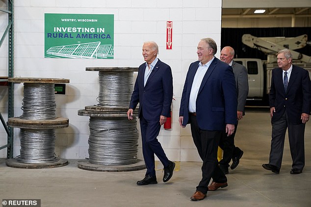 President Joe Biden (L) toured Vernon Electric Cooperative in Westby, Wisconsin, on Thursday and touted investments in green energy to power rural areas across the U.S. He was accompanied on the trip by Agriculture Secretary Tom Vilsack (R).