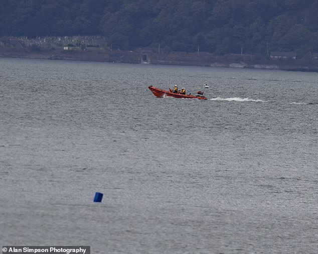 The search continued with a police presence in Granton Harbour (pictured: a boat searching for the missing woman)