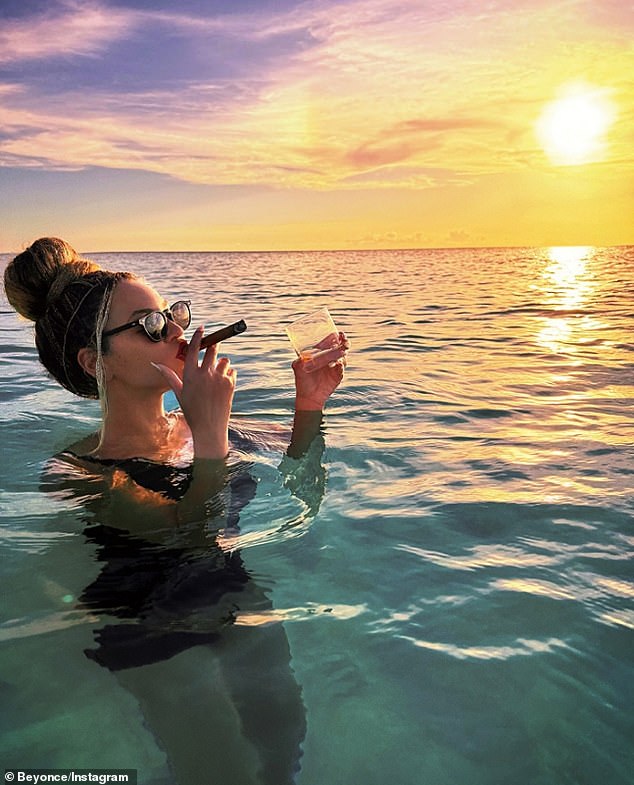 The superstar started her first post with a photo of herself enjoying a late night swim and smoking a cigar while holding a drink in her other hand