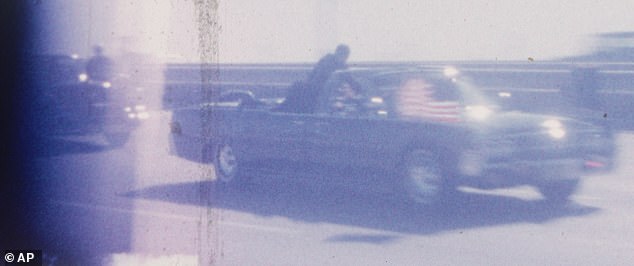 The photo shows Secret Service agent Clint Hill heroically using his body as a human shield in the back of the car carrying the president as the car speeds toward Parkland Hospital at 80 mph.