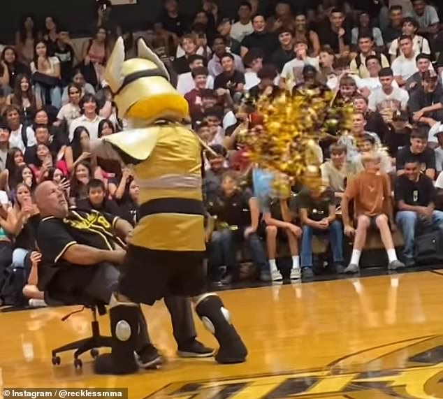 The video, posted to social media, shows Buhach Colony High School's Robert Nunes sliding into an office chair as the school mascot walks toward him during an assembly celebrating the start of the school year.