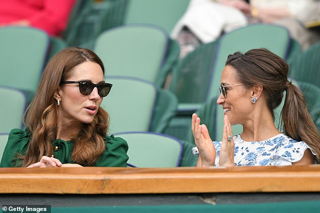 The sisters chat while watching a tennis match at Wimbledon in 2019