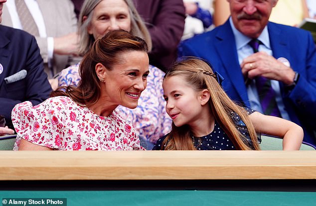 Pippa leans forward to listen to her niece, Princess Charlotte, as they watch tennis in July