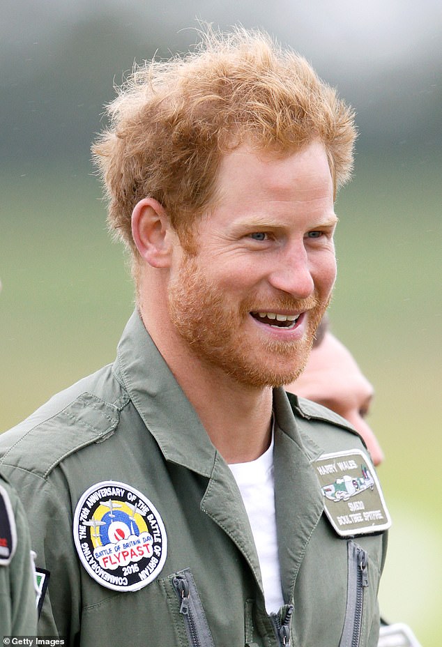 Prince Harry may be known for his red hair, but he's had it for so long that it's hard to imagine him clean-shaven (2015 photo)