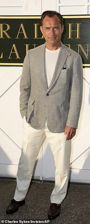 Jude opted for a summery chic look by pairing a grey blazer jacket with cream trousers and a simple white T-shirt