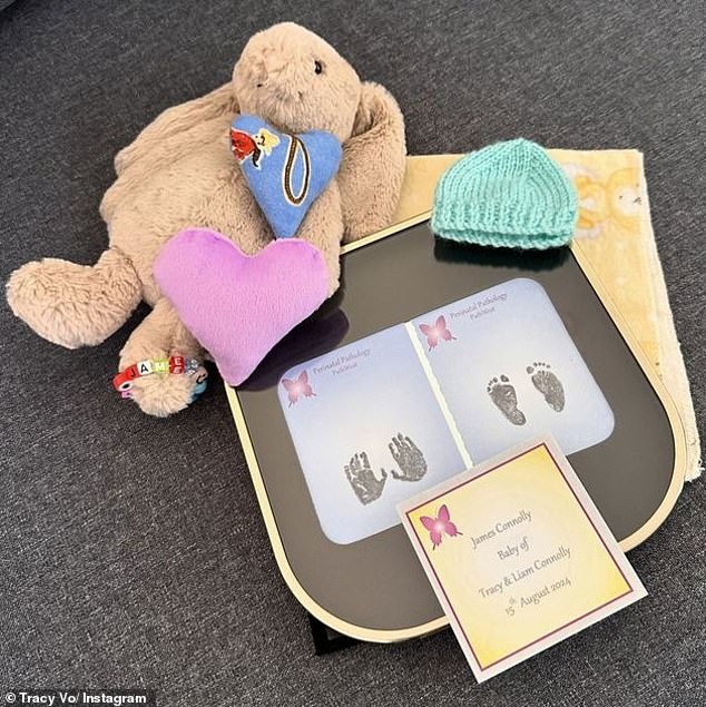 Tracy shared a photo of her baby's hand and footprints, which were next to a toy bunny and a hat, and wrote a heartfelt tribute in the caption