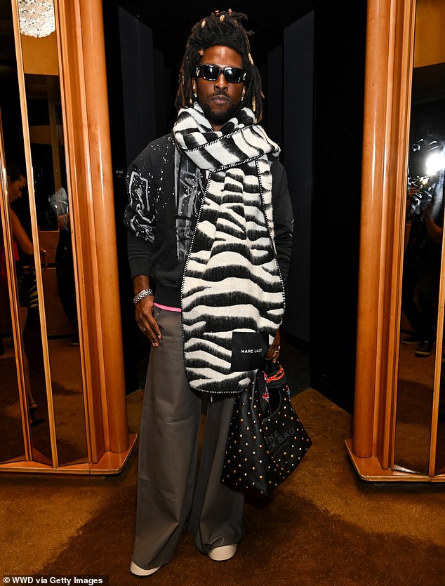 Guyanese-American SAINt JHN, 38, looked amazing in an oversized zebra print scarf and baggy gray pants