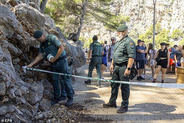 Guardia Civil can be seen in the area where emergency services continue to search for a British national who went missing yesterday in Torrent de Pareis, Mallorca.