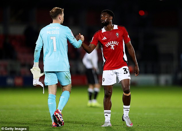 Keane complained about the number of touches Gill (left) took as MK Dons searched for a goal to get back on track in their League Two clash with Salford City on Monday night