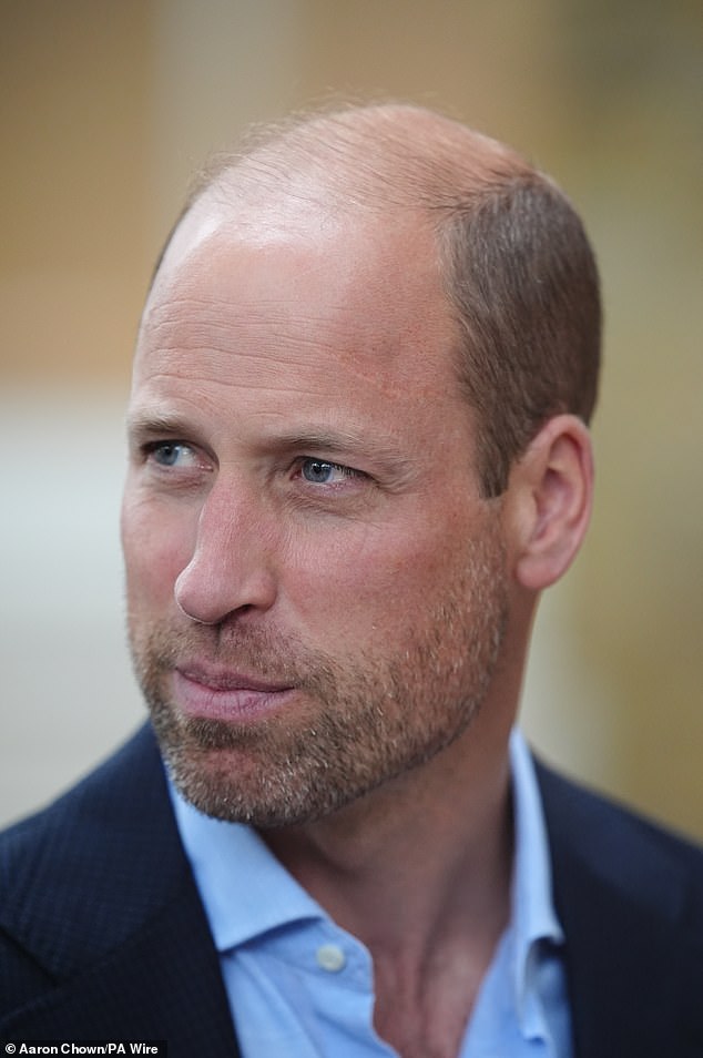 Prince William sported a beard today as he returned to royal duties after his summer vacation