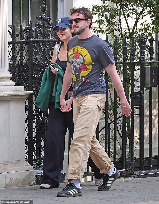 Paul wore a graphic 'Guns 'N' Roses' T-shirt, paired with beige chino pants and trendy Adidas trainers