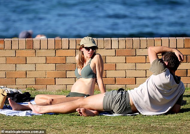 Becky showed off her growing baby bump as she relaxed on the beach with Pat during the outing