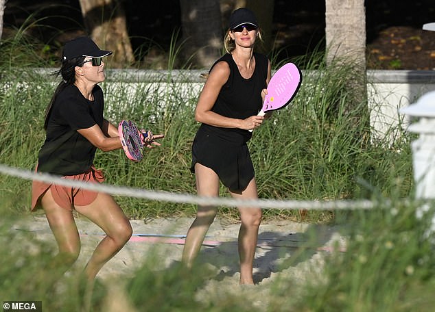 The catwalk veteran styled her hair in a long braid and wore a black cap to shield her money-making face from the harsh rays of the sun.