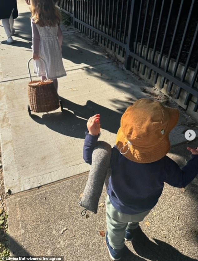 One photo showed her two-year-old son Tom holding onto the doorstop of their home as they walked with her. Edwina revealed in an emotional caption that it was a 'reminder that life goes on'