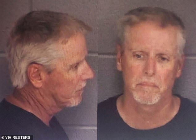 His father, 54-year-old Colin Gray, is accused of buying his 14-year-old son Colt the AR-15-style rifle the boy used. He was arrested Thursday on suspicion of second-degree murder, manslaughter and cruelty to children.