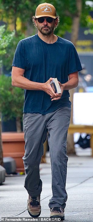 The Hangover heartthrob exuded his smoldering Hollywood magnetism in a simple navy T-shirt that accentuated his muscular arms