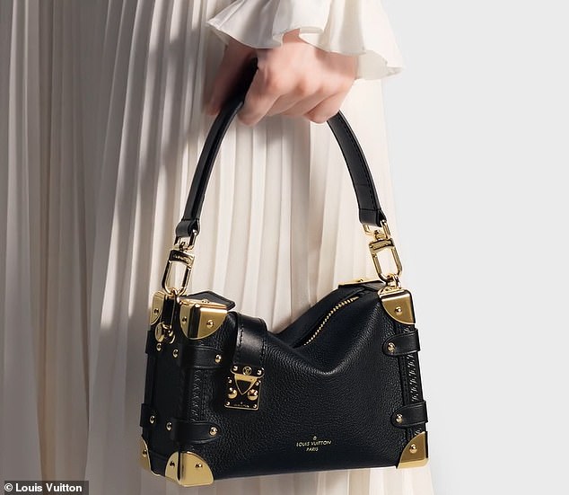 She paired it all with a small black Louis Vuitton briefcase with gold detailing that retails for $3,950 — in keeping with the Chiefs' signature red color, of course.