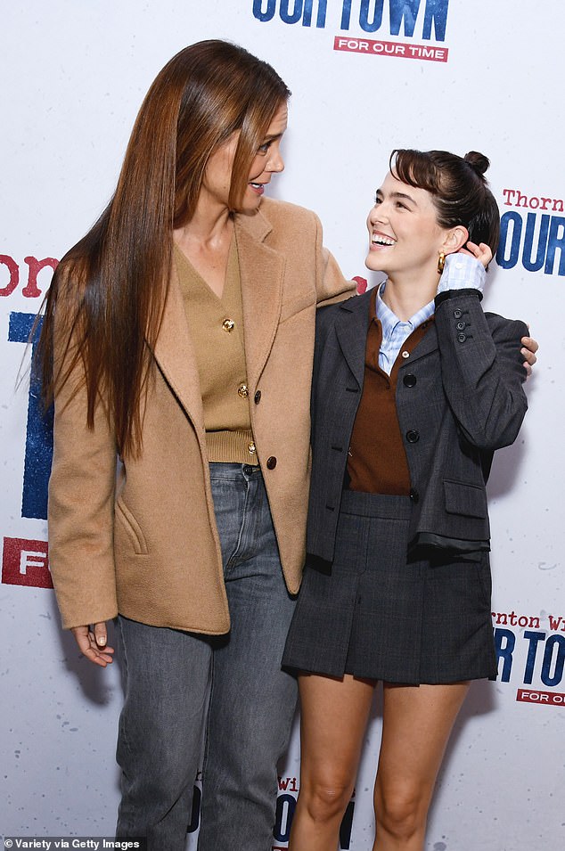 Deutch, 29, showed off her lithe legs in a gray pleated miniskirt with a matching jacket. The actress, who is the daughter of actress Leah Thompson, 63, and director Howard Deutch, 73, paired the suit with a blue-and-white checked blouse and a rust-colored sweater