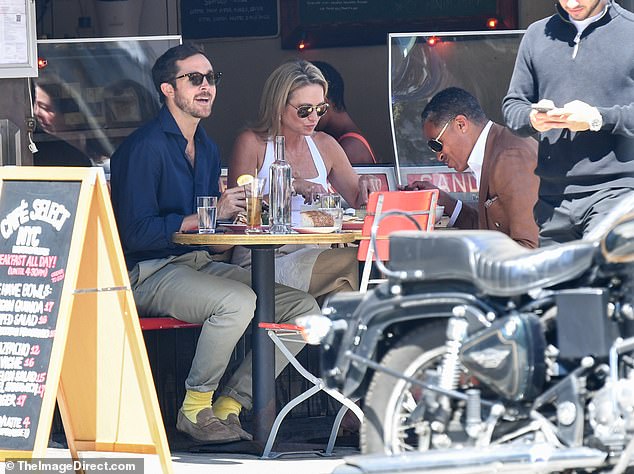 Exclusive photos show the trio chatting and laughing as they enjoyed food and drinks al fresco at trendy Cafe Select in Soho