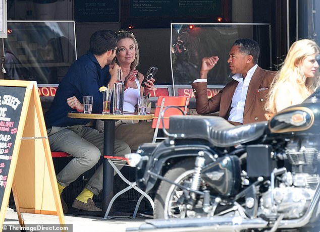 The Tyson Foods heir also wore business casual attire: a navy shirt, brown pants and loafers with bright yellow socks.