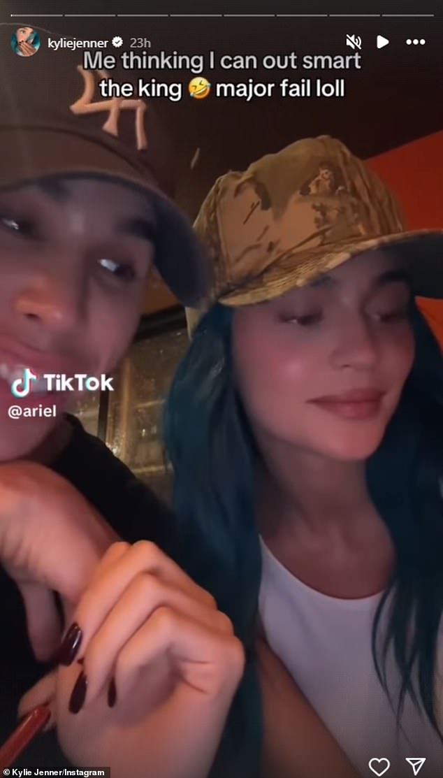 In a short video clip Kylie shared on social media, she was seen wearing a camouflage hat over her blue hair as she spoke to a friend