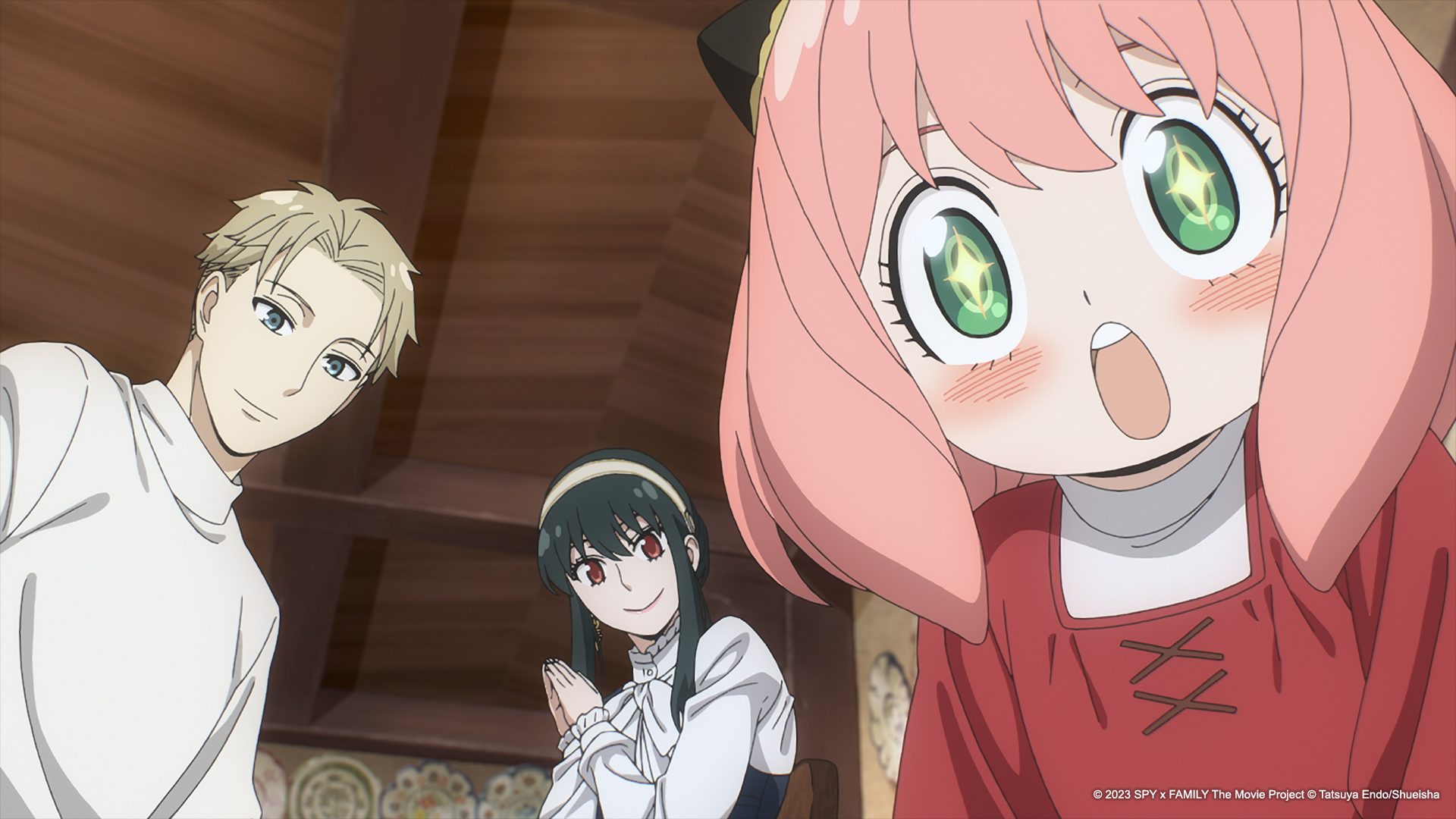 An anime girl with bright eyes and pink hair looks at two other smiling anime characters in Spy x Family Code: White.