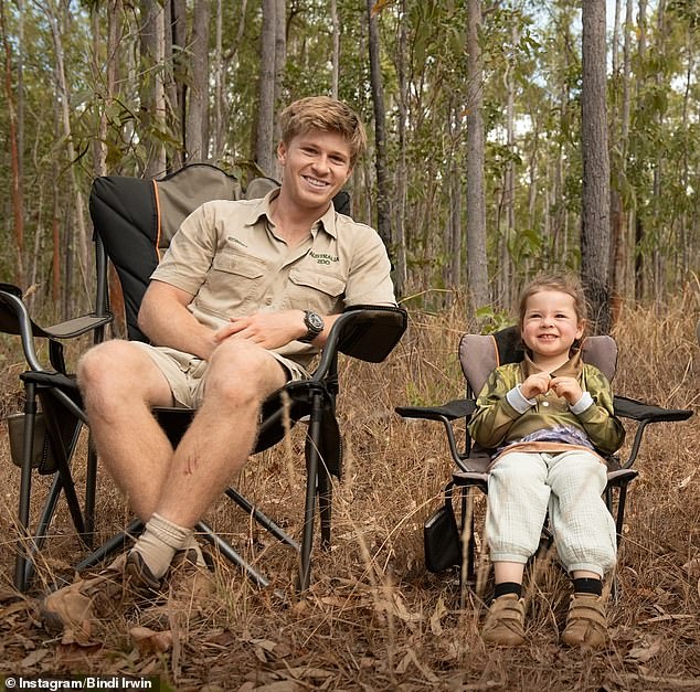 Robert couldn't get the smile off his face as he brazenly acted for the camera next to young Grace