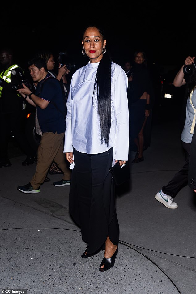 Tracee Ellis Ross, 51, opted for a white blouse, black maxi skirt and open black heels