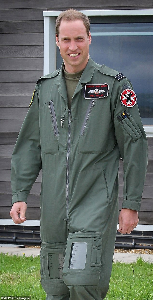 William was a Sea King search and rescue pilot based at RAF Valley in Wales. Above: In his uniform at RAF Valley during his father's visit to the base, July 2012