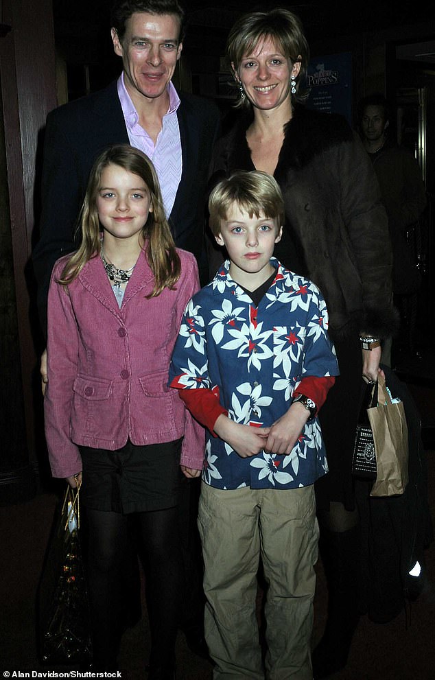 Alexander with his sister Flora and parents James and Julia Ogilvy in 2004