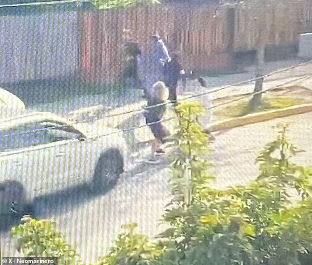 A still image from a video showed an SUV driven by a boy about to run over his mother before hitting the father, a student with whom he was involved in a fight at a school in Puente Alto, Chile, on Thursday.