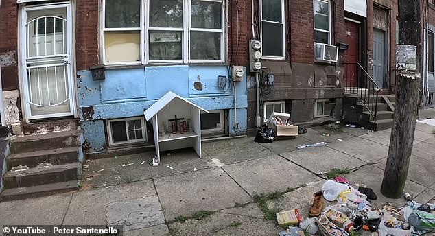 As Peter and Buddy walk through the trash-strewn streets, they see a small shrine marking the spot where someone died