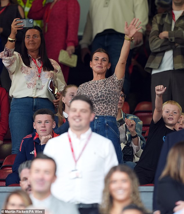 The 38-year-old WAG, who attended the match to support her husband Wayne Rooney, also 38, appeared to be in high spirits as she and her sons watched Wayne battle the Celtic legends